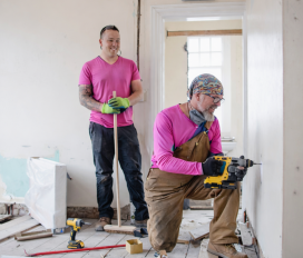 Workers renovating a room