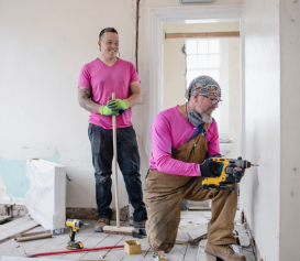 Workers renovating a room