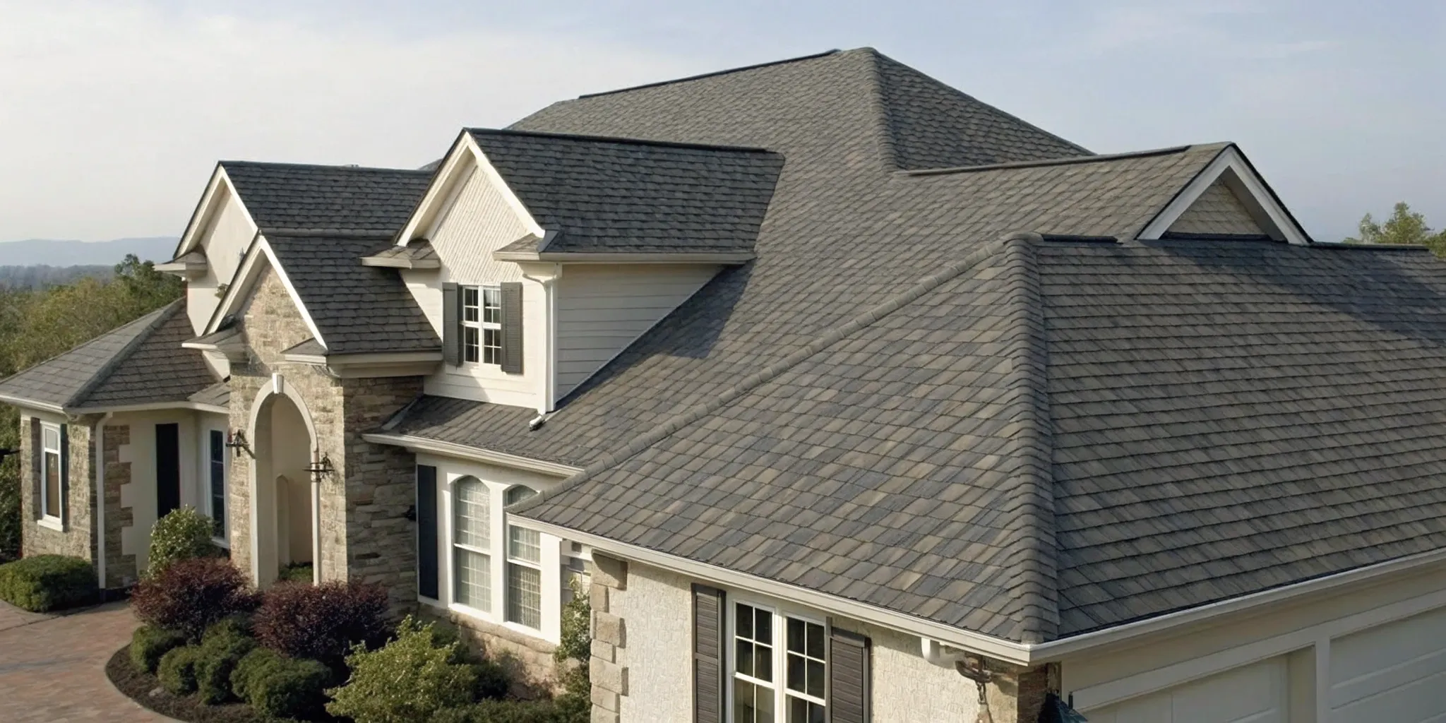 Owens Corning asphalt shingles installed on a home, a key part of the overall roof price.