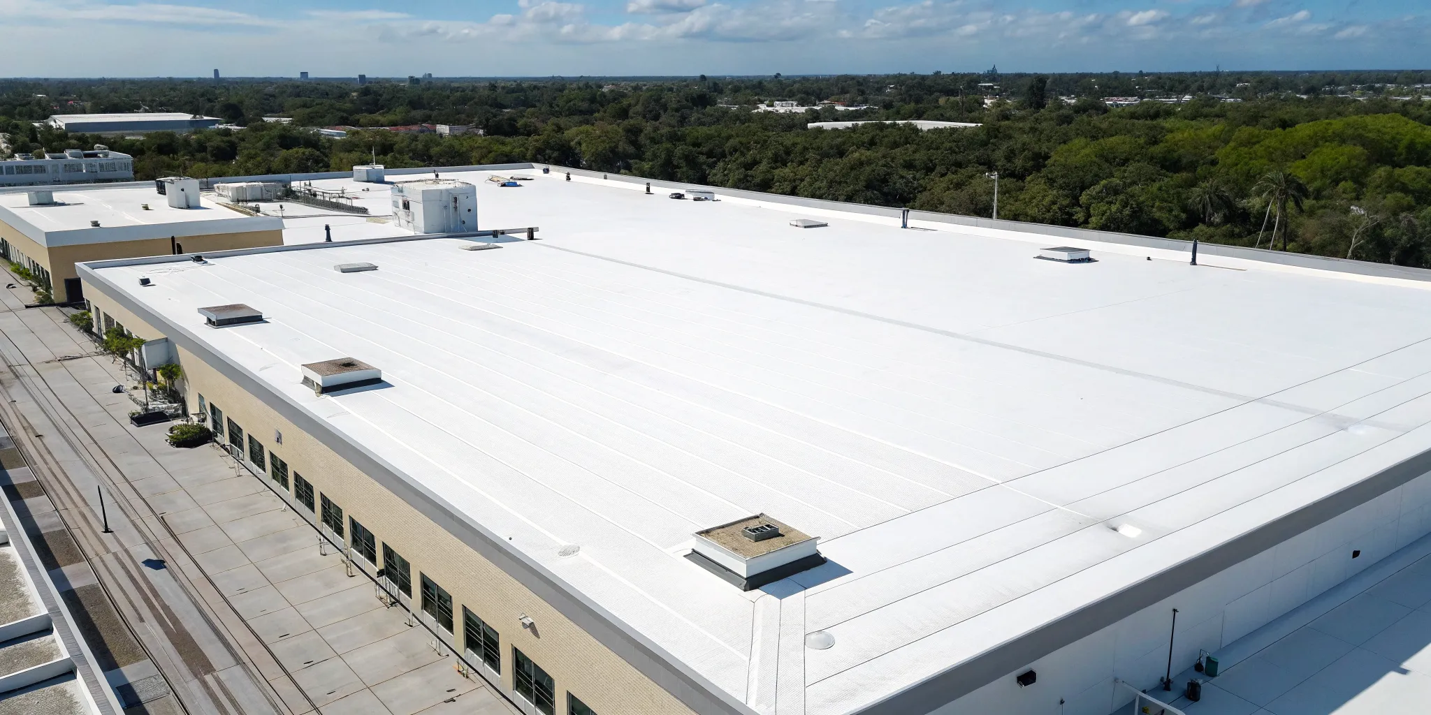 An energy-efficient commercial TPO roof on a business in Orlando.