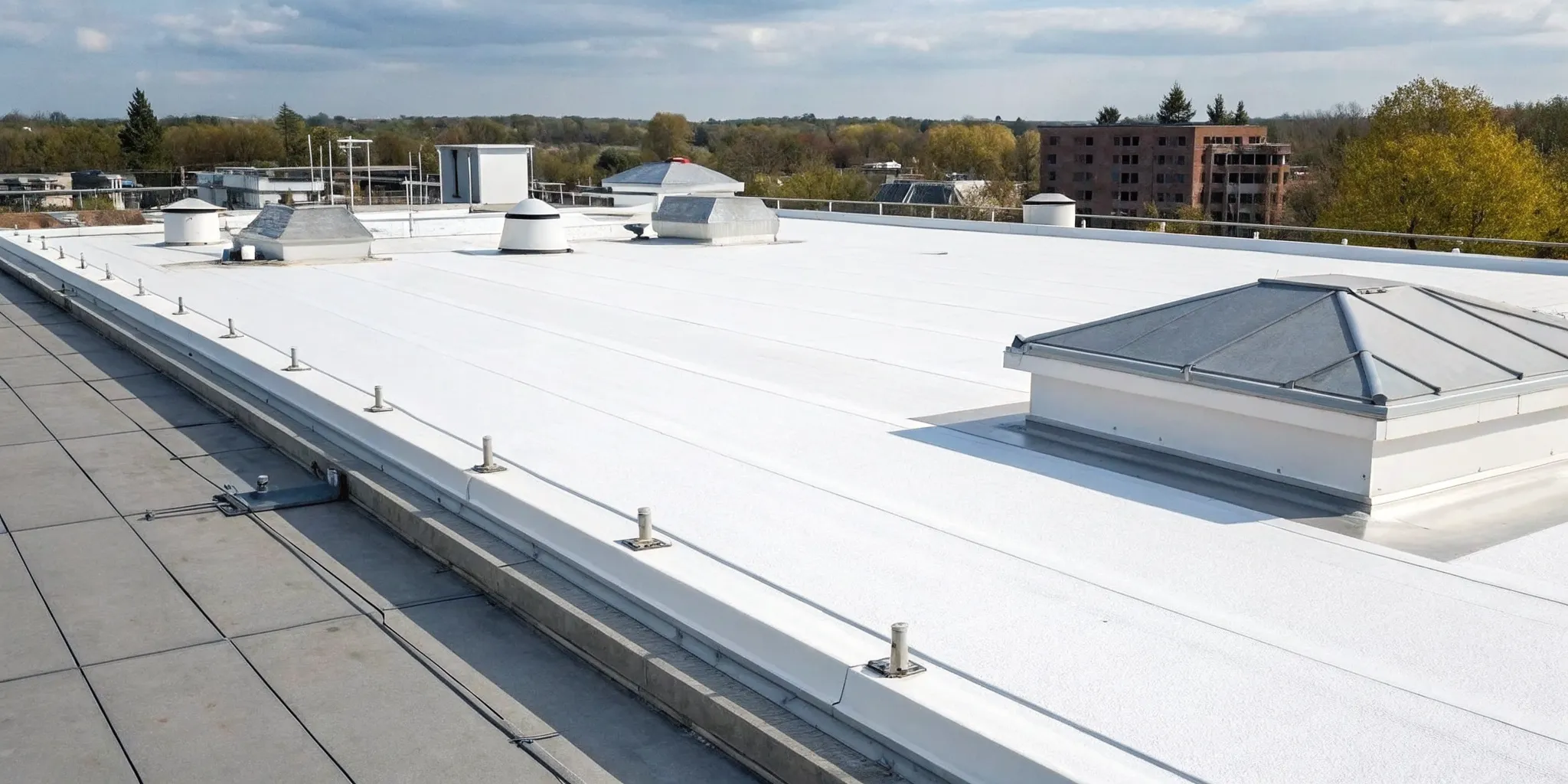 TPO roofing membrane and flashing details correctly installed at a parapet wall.